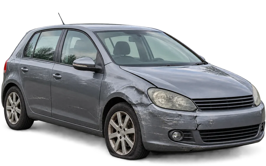 Damaged grey hatchback with a flat tyre, the kind of vehicle we buy for scrap
